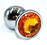 Серебристая анальная пробка с желтым кристаллом - 7 см. (Цвет: оранжевый)