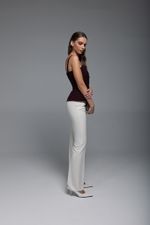 Брюки расклешенные от колена (в оттенке айвори)