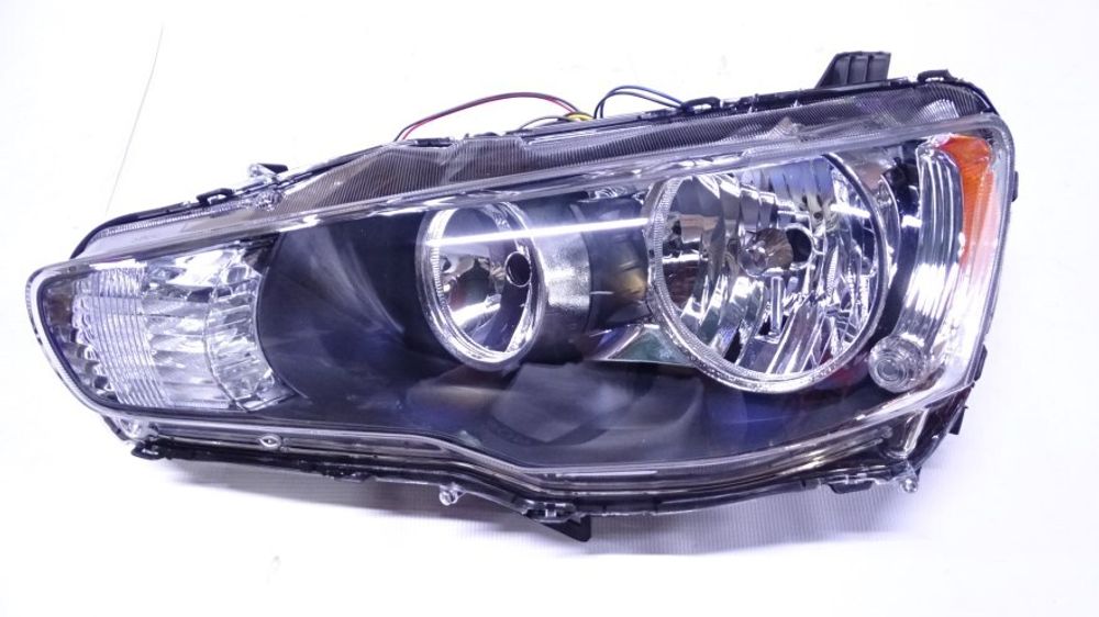 Фара Mitsubishi Lancer X лев. /мех. корр./ (COMPONENT)
