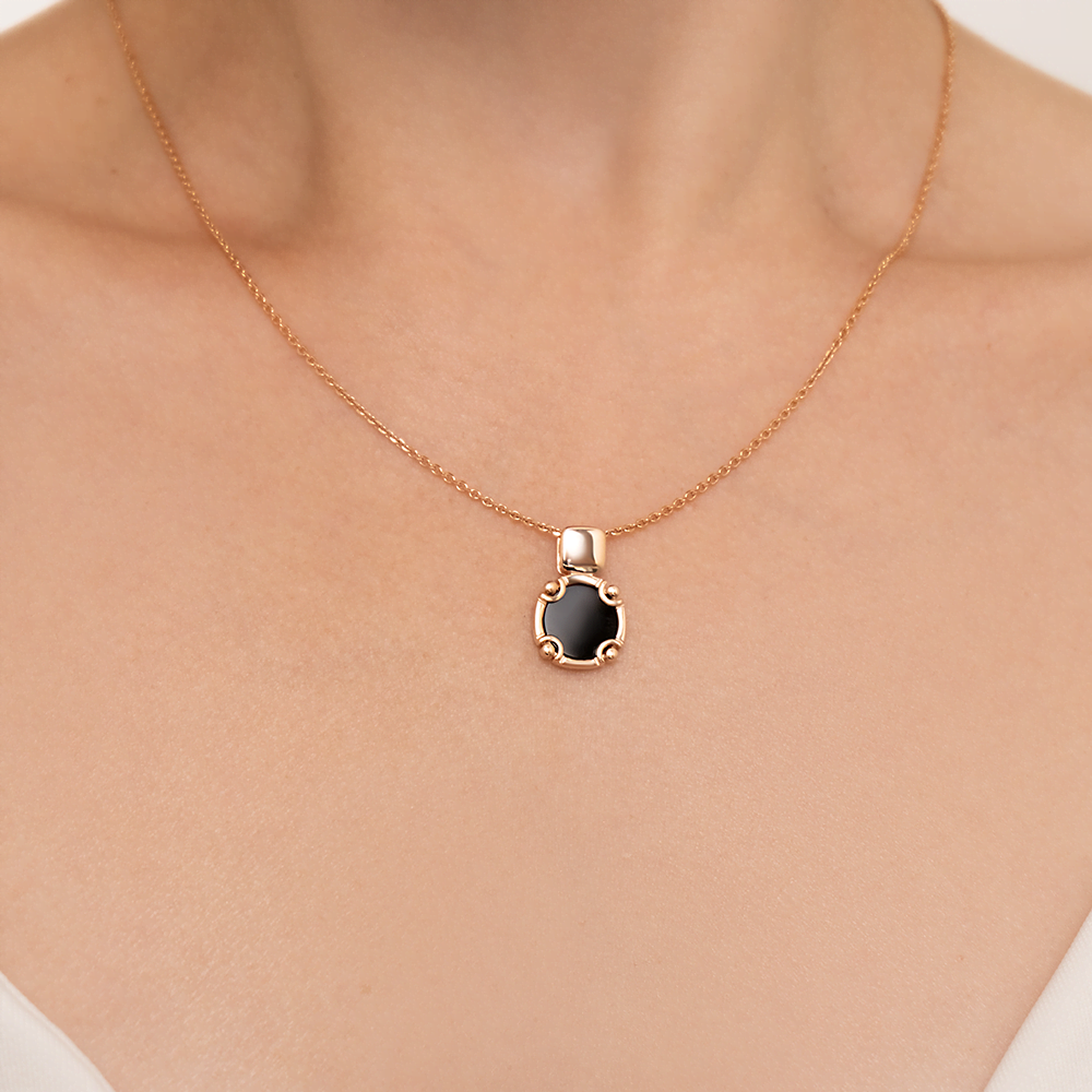 Подвеска из красного золота с ониксом