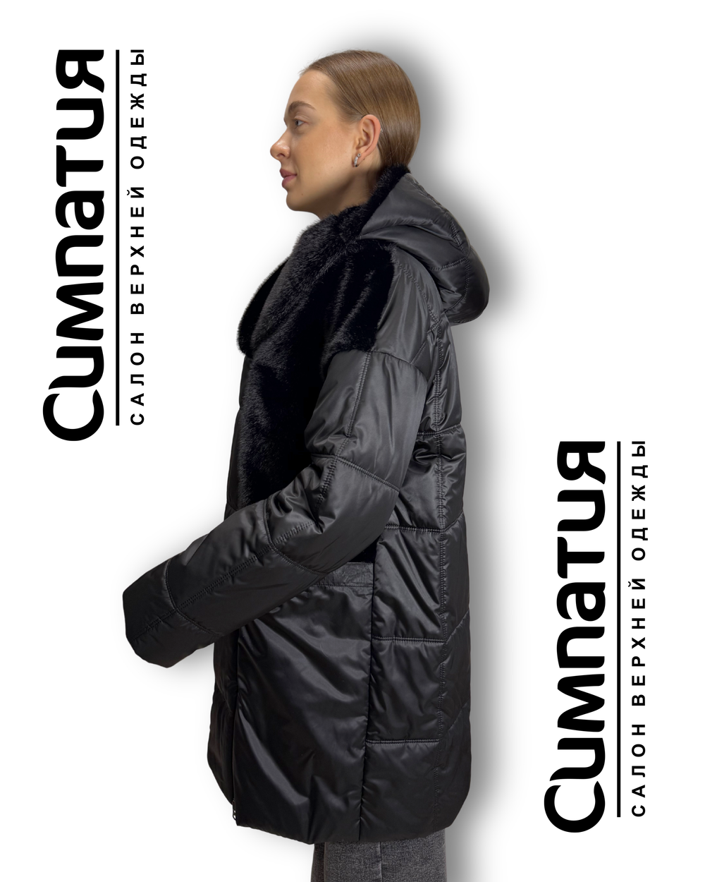 Теплое пальто черного цвета и отделкой из эко меха норки