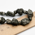 Пирит необработанный бусины, размер около 5-15 мм, цена за отрезок 15 см