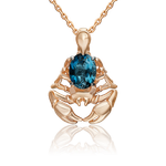 Подвеска «Скорпион» из красного золота с топазом