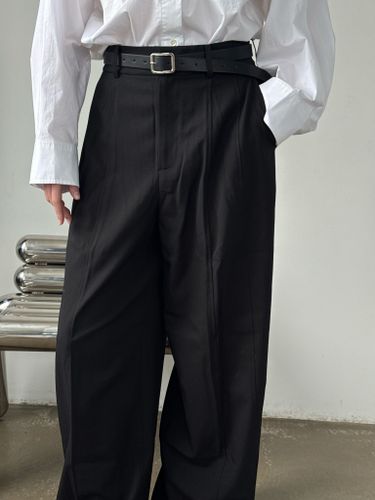 Широкие черные брюки с застежками по низу