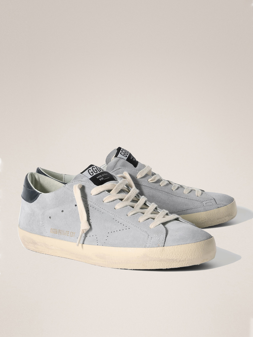 Men's Super Strar in light blue suede with a blue insert on the heel and a perforated star