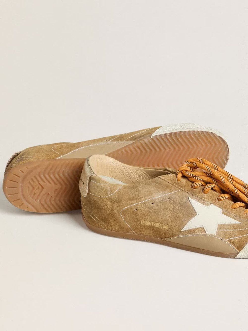 True Star in tobacco-colored suede with white star and platinum heel tab