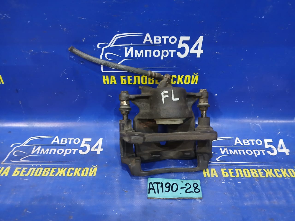 Суппорт тормозной передний левый TOYOTA CARINA E 1992