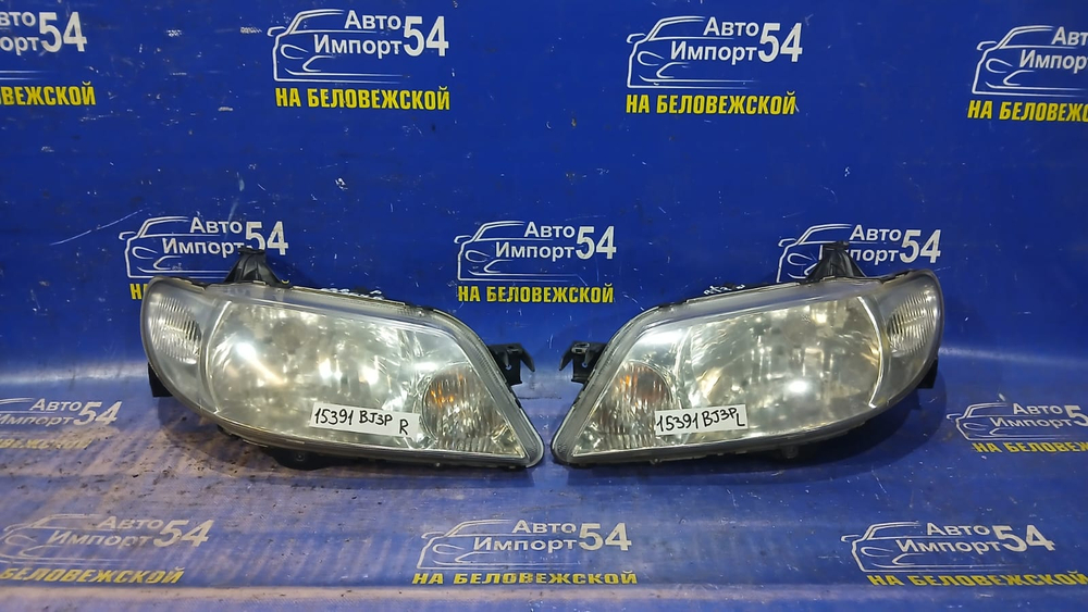 Фара передняя левая MAZDA FAMILIA 2000-2003