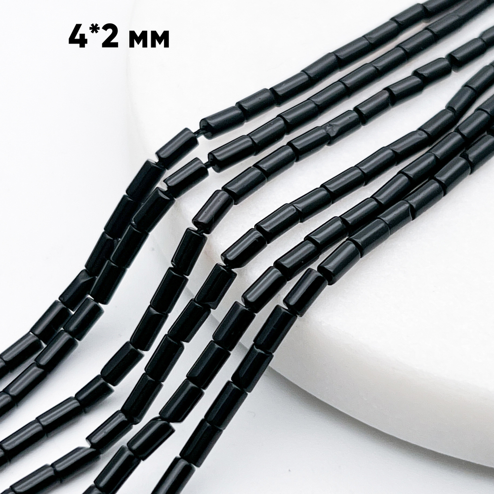 Халцедон тонированный черный, размер около 4,3*2,2 мм, цена за отрезок 19 см (1/2 нити)