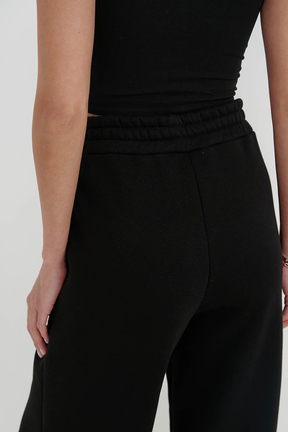 Утепленные брюки клеш черного цвета