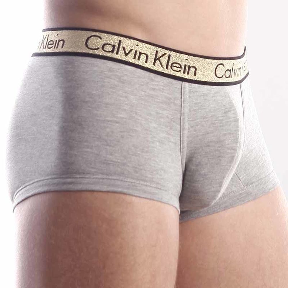 Мужские трусы хипсы серые с золотистой резинкой  (модал) Calvin Klein Trunks One