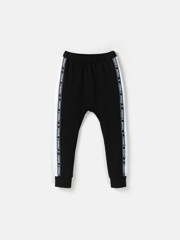 Брюки со спущенным шагом и лампасами 