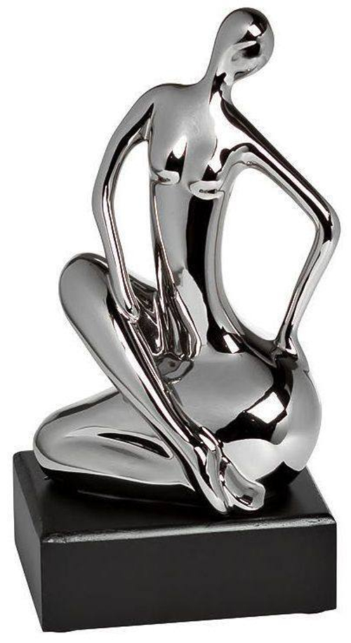 Статуэтка "Женщина" (сид.на боку) серебряная