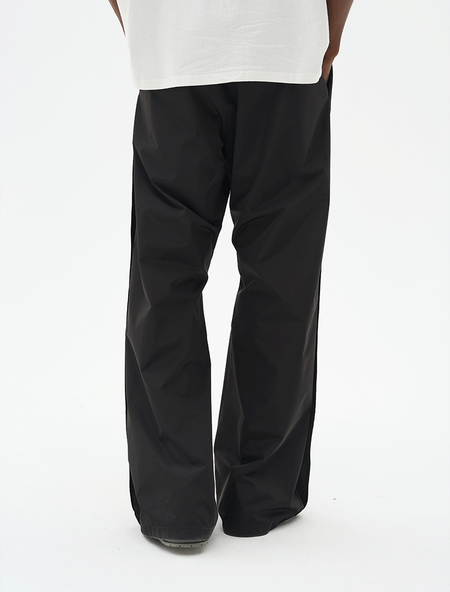 Брюки HARSHandCRUEL Wide fit Nylon Buttoned Pants