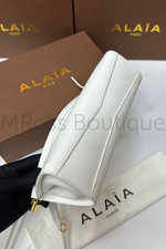 Женская сумка Alaia Le Click East West белого цвета