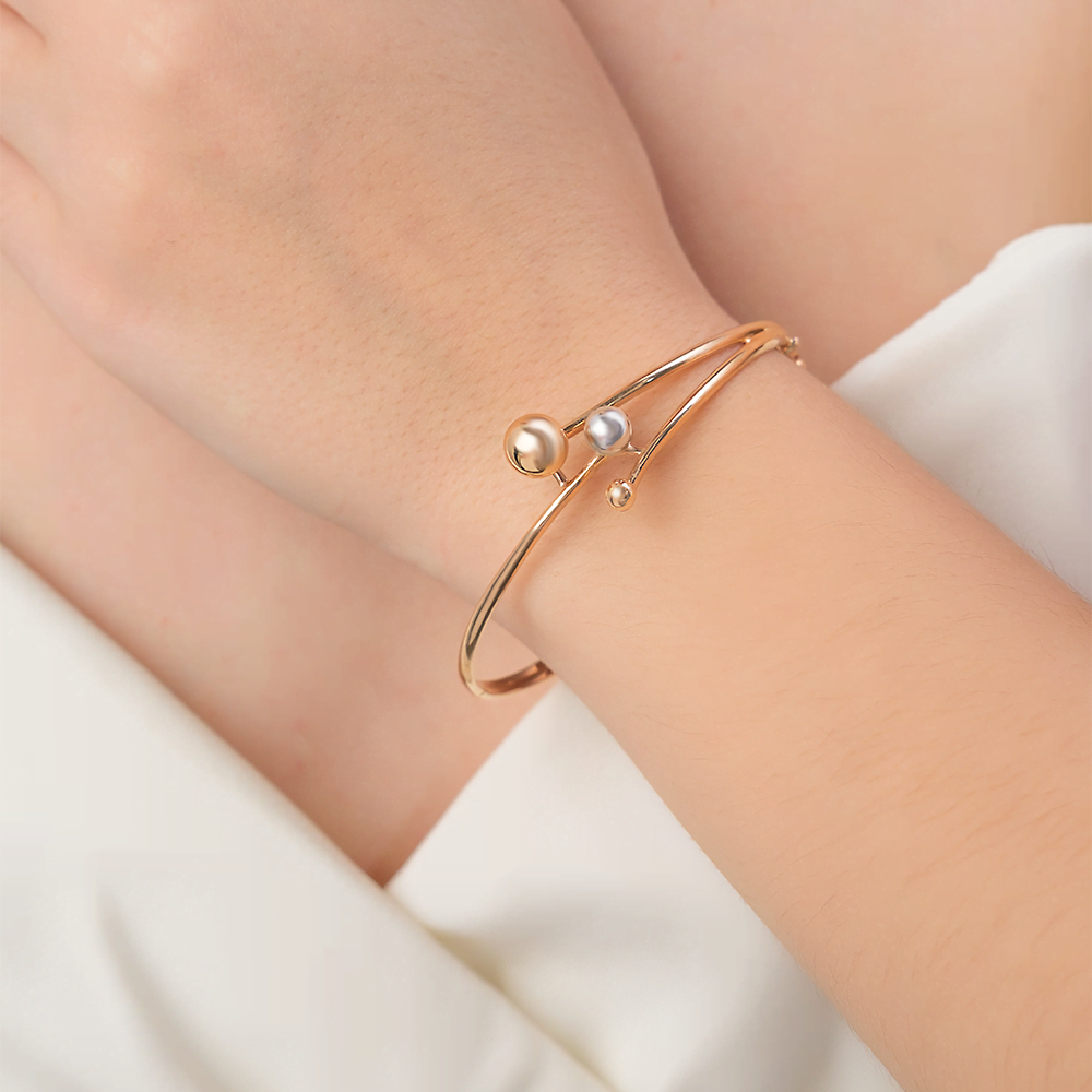 Браслет жесткий из комбинированного золота