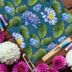 Ткань кулирная гладь голубые кувшинки на бирюзовом фоне с надписями