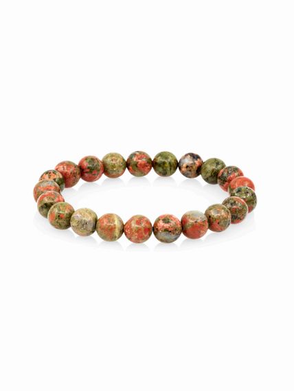 Фото браслета из яшмы унакит на белом фоне вид сбоку