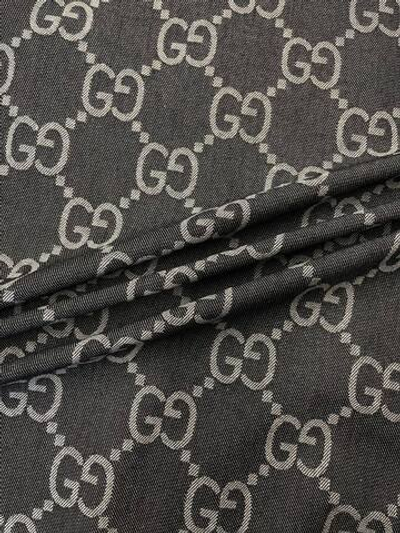 Джинса (деним) хлопковая Gucci синяя с дизайнерским лого