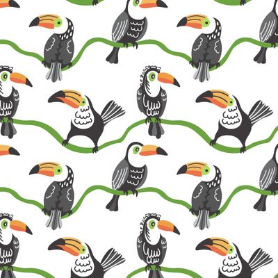 Черно-белые туканы сидят на зеленой лиане