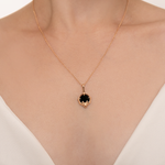 Подвеска «Летучая мышь» из красного золота с ониксом