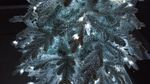 Заснеженная ель с гирляндой «Россо» холодный свет (Литая+пвх) 180 см / 1,8 м