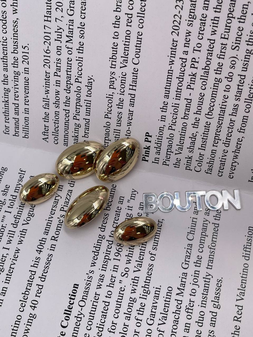 Пуговицы золотые овальные