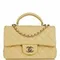 Стеганая мини-сумка Chanel с ручкой