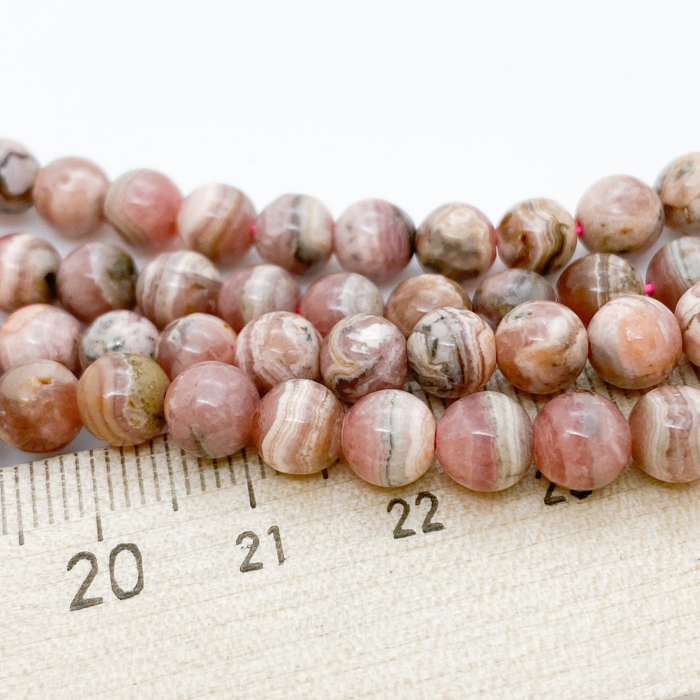 Бусины Родохрозит, диаметр 5,9-6,3 мм, цена за 16 шт (1/4 нити)