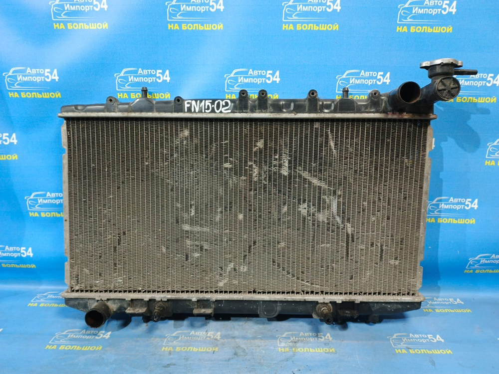 Радиатор двигателя NISSAN PULSAR 1999