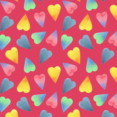 Разноцветные акварельные сердечки на розовом фоне
