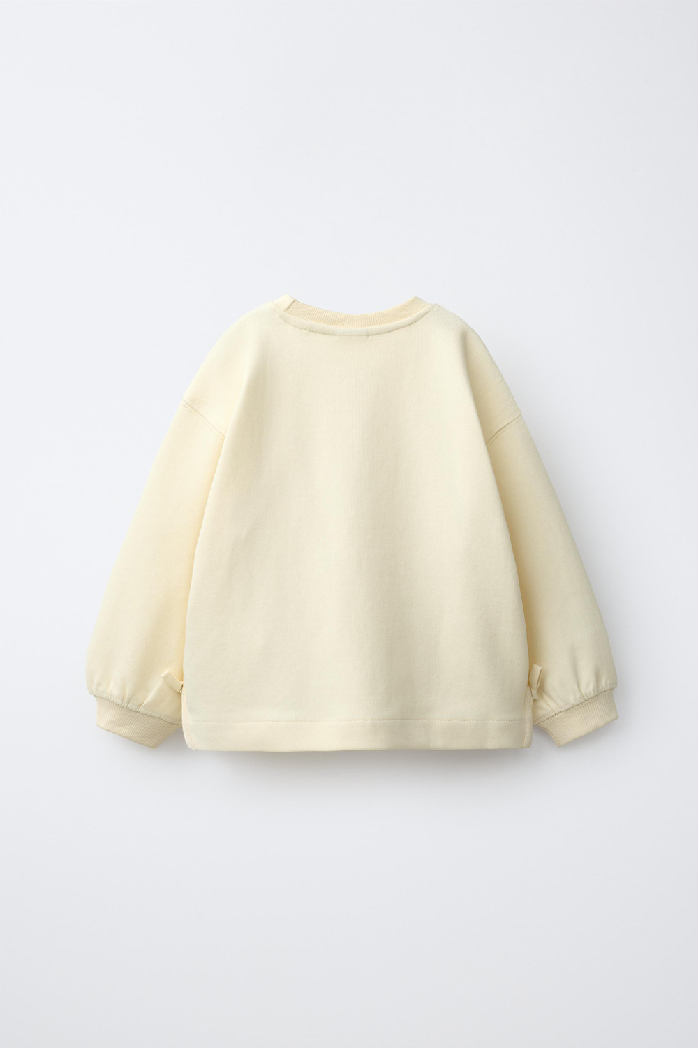 ZARA ТОЛСТОВКА С БАНТАМИ И СЕРДЦЕМ, ЦВЕТ СЛИВОЧНОГО МАСЛА