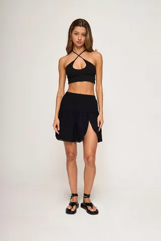 Мини юбка-лепесток из жатого хлопка черного цвета