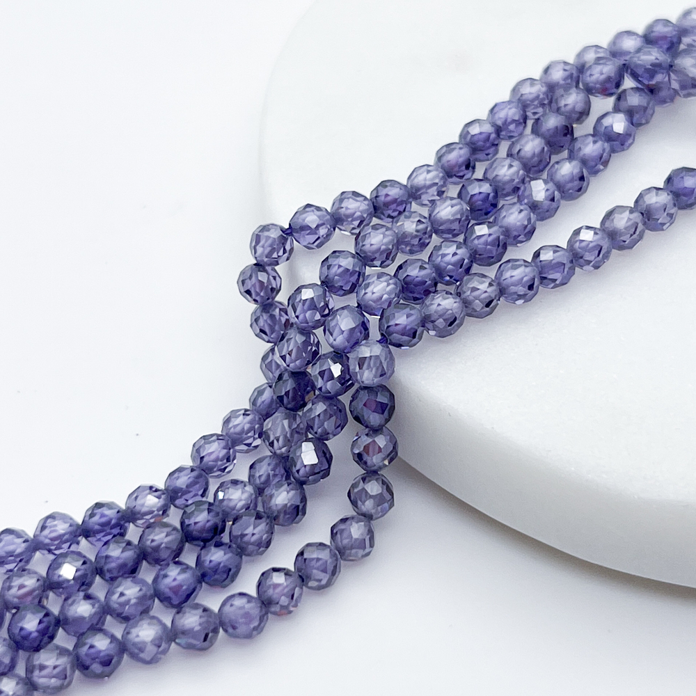 Фианит (кубический цирконий), цвет фиолетовый, размер 4 мм, цена за отрезок 19 см (1/2 нити)