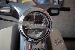 33100-K0G-902. HEADLIGHT ASSY., Honda C125