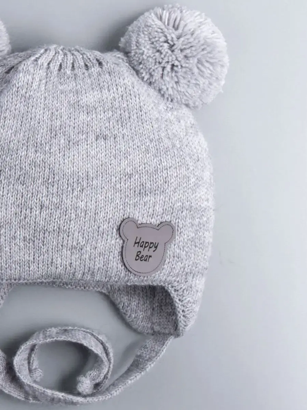 Шапка детская осенняя с завязками и помпонами