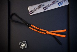 Черно-оранжевый плоский темляк