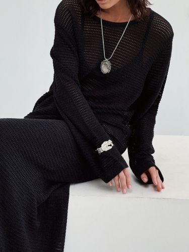 Черный вязаный костюм из лонгслива и юбки