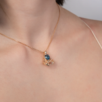 Подвеска «Скорпион» из красного золота с топазом