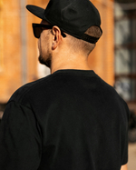 Футболка черная с лого на груди S