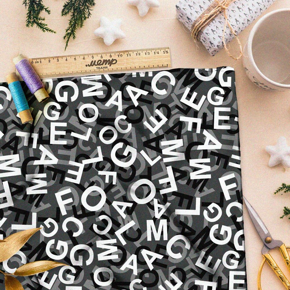 Ткань бифлекс хаос их букв на чёрном фоне