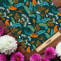 Ткань оксфорд 600 синие листья с оранжевыми птицами