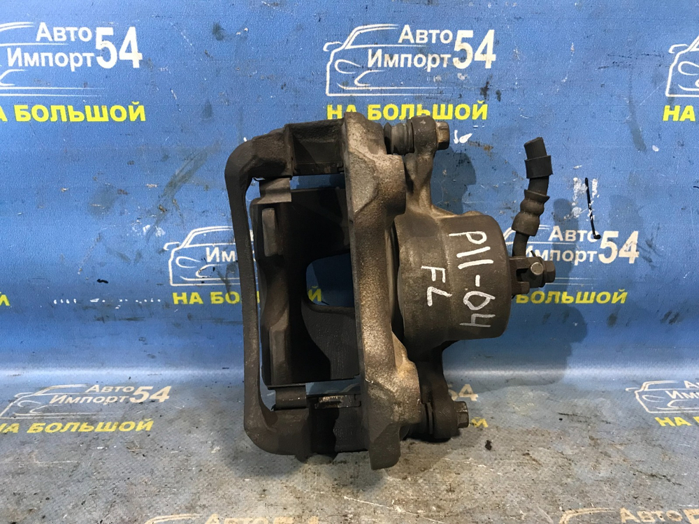 Суппорт тормозной передний левый NISSAN PRIMERA 1999
