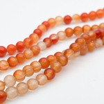 Сердолик бусины, диаметр 6,2-6,3 мм, цена за 29-30 шт (1/2 нити)