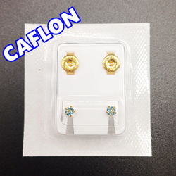 Серьги-гвоздики для прокола ушей под пистолет. CAFLON (Англия). Золотистые со светло-голубыми кристаллами, крапление