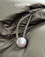 Удлиненный пуховик цвета кофе с глубоким капюшоном и кулисной на воротнике