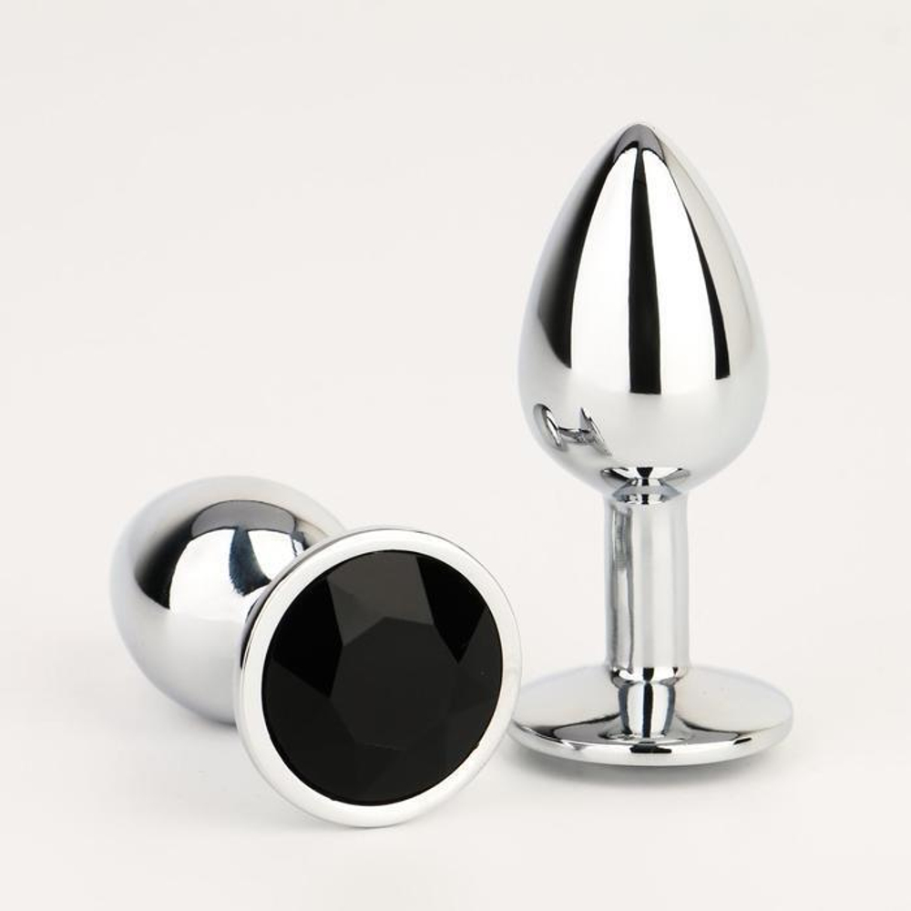 Серебристая анальная втулочка с черным кристаллом - 7 см. (Цвет: серебристый)