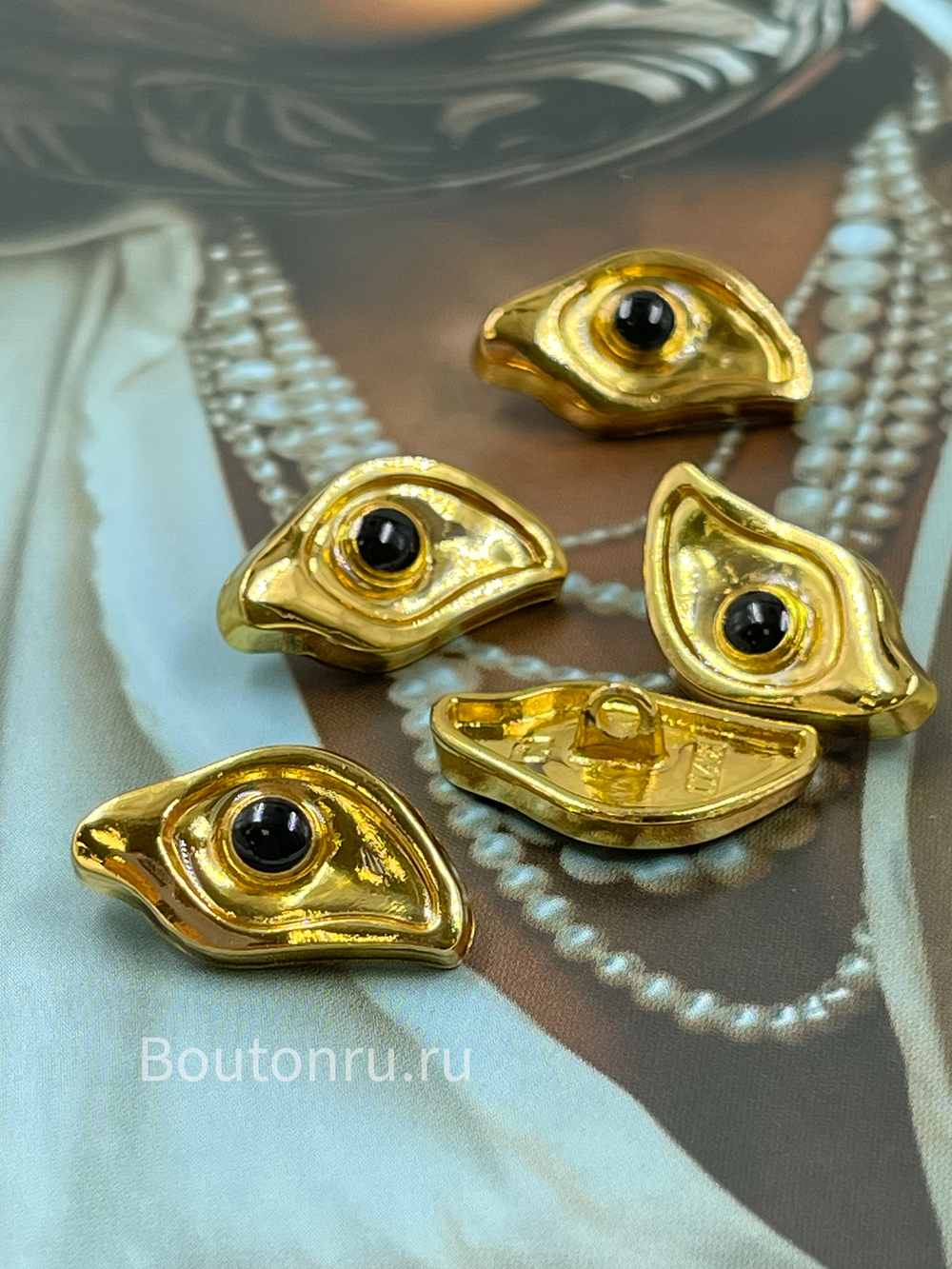 Пуговицы золотистые в форме глаза Скиапар.