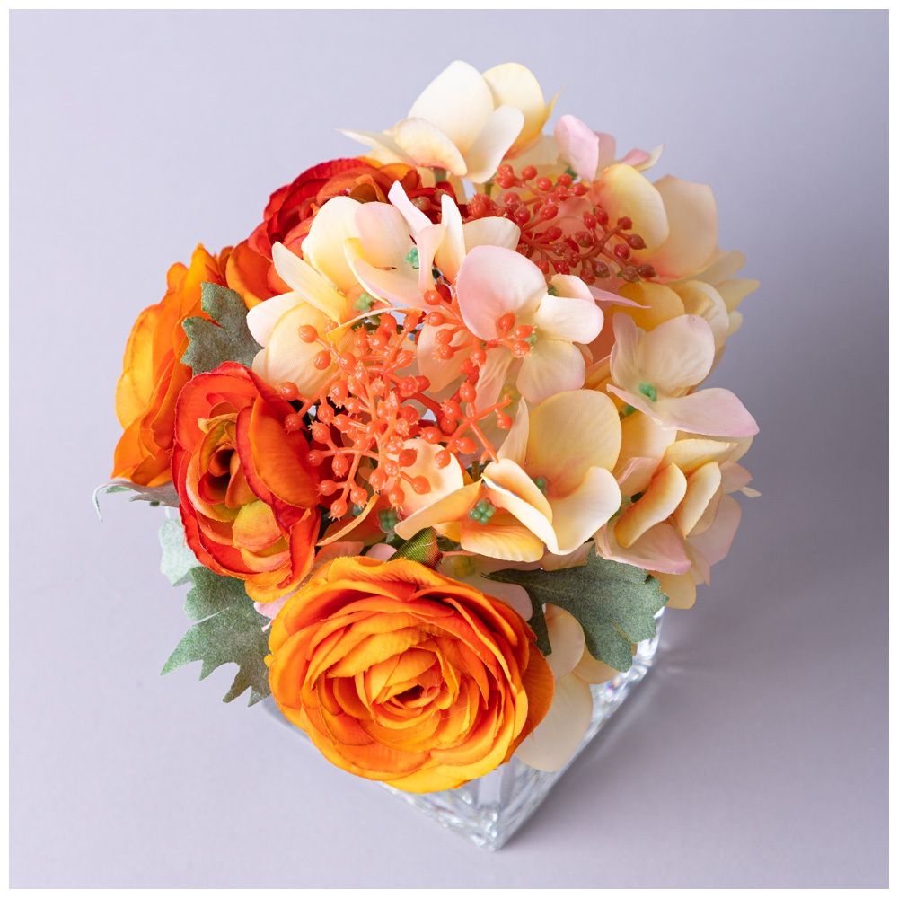 БУКЕТ ИСКУССТВЕННЫХ ЦВЕТОВ В КВАДРАТНОЙ ВАЗЕ ВЫСОТА= 16СМ (МАЛ=8ШТ./КОР=24ШТ.)