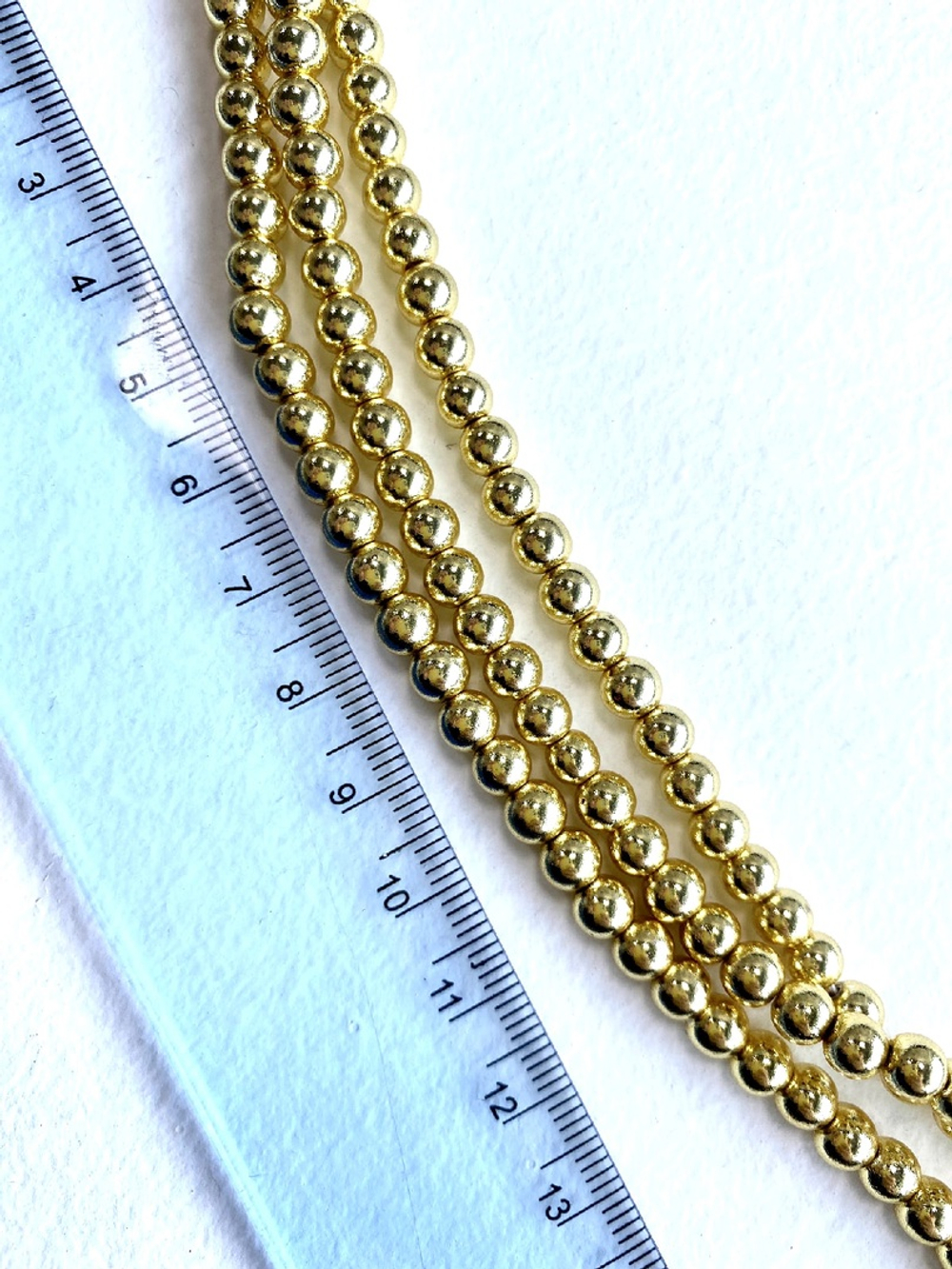 гшг5-з Гематит люкс 5мм, шар, цвет - золото, 20см